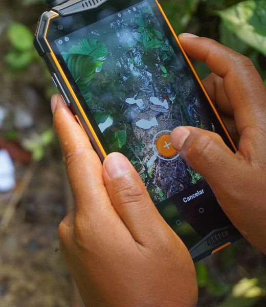 A close up view of Mapeo Mobile in someone's hands